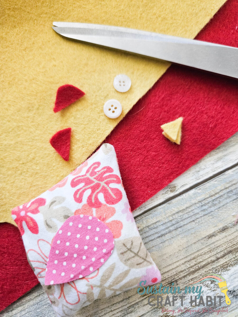 Cutting pieces of felt. 