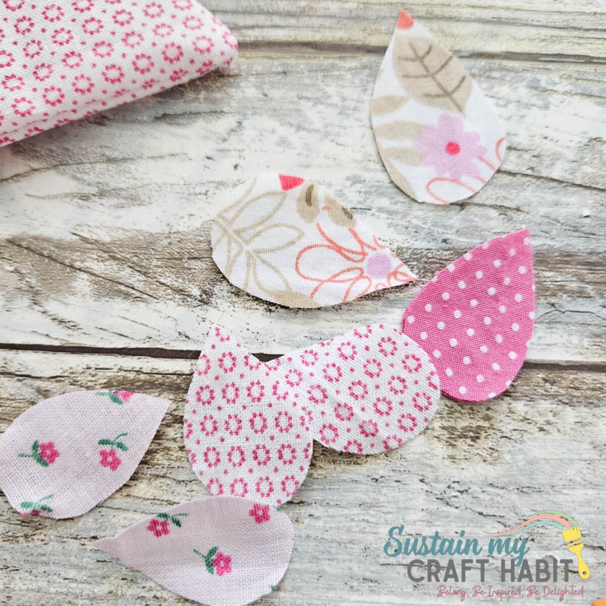 Wing shapes cut out of fabric.