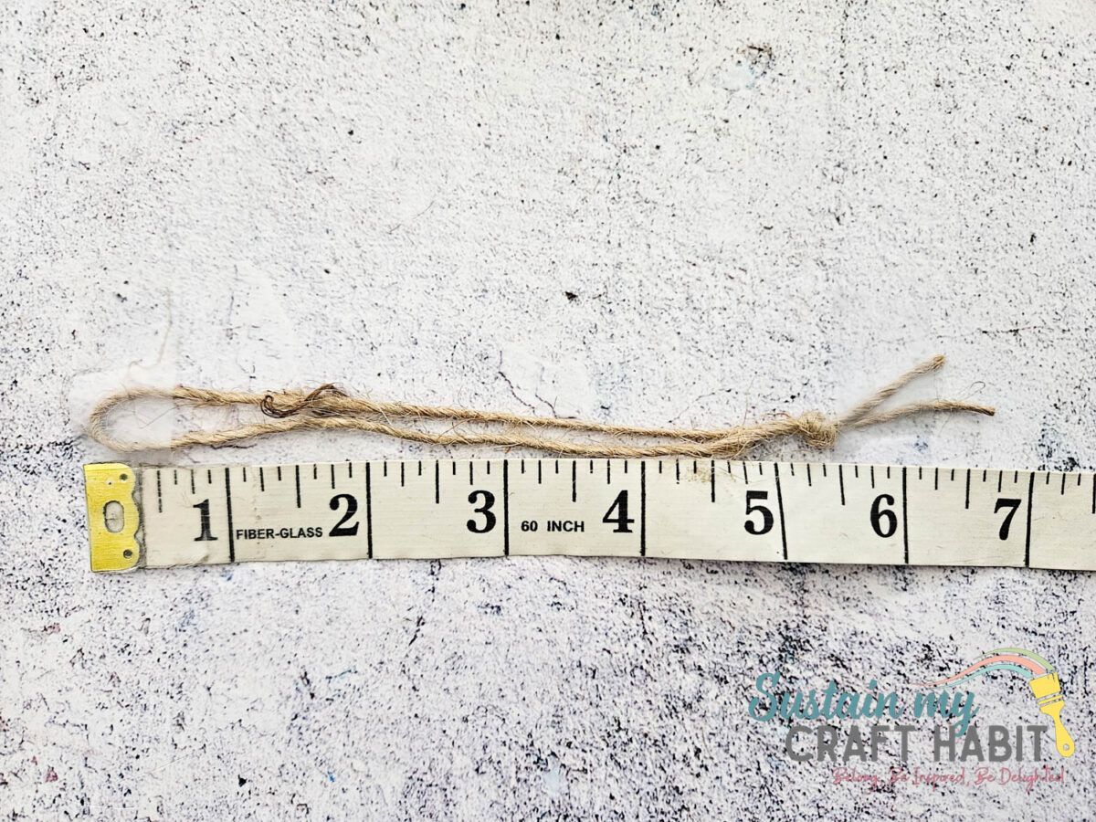 Folding a piece of twine and tying a knot at the end. 