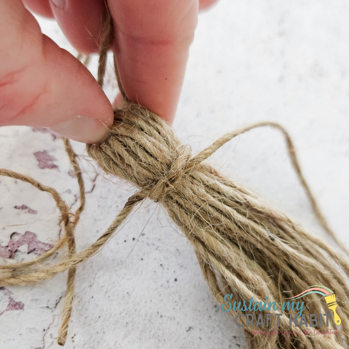 Tying a knot around twine. 