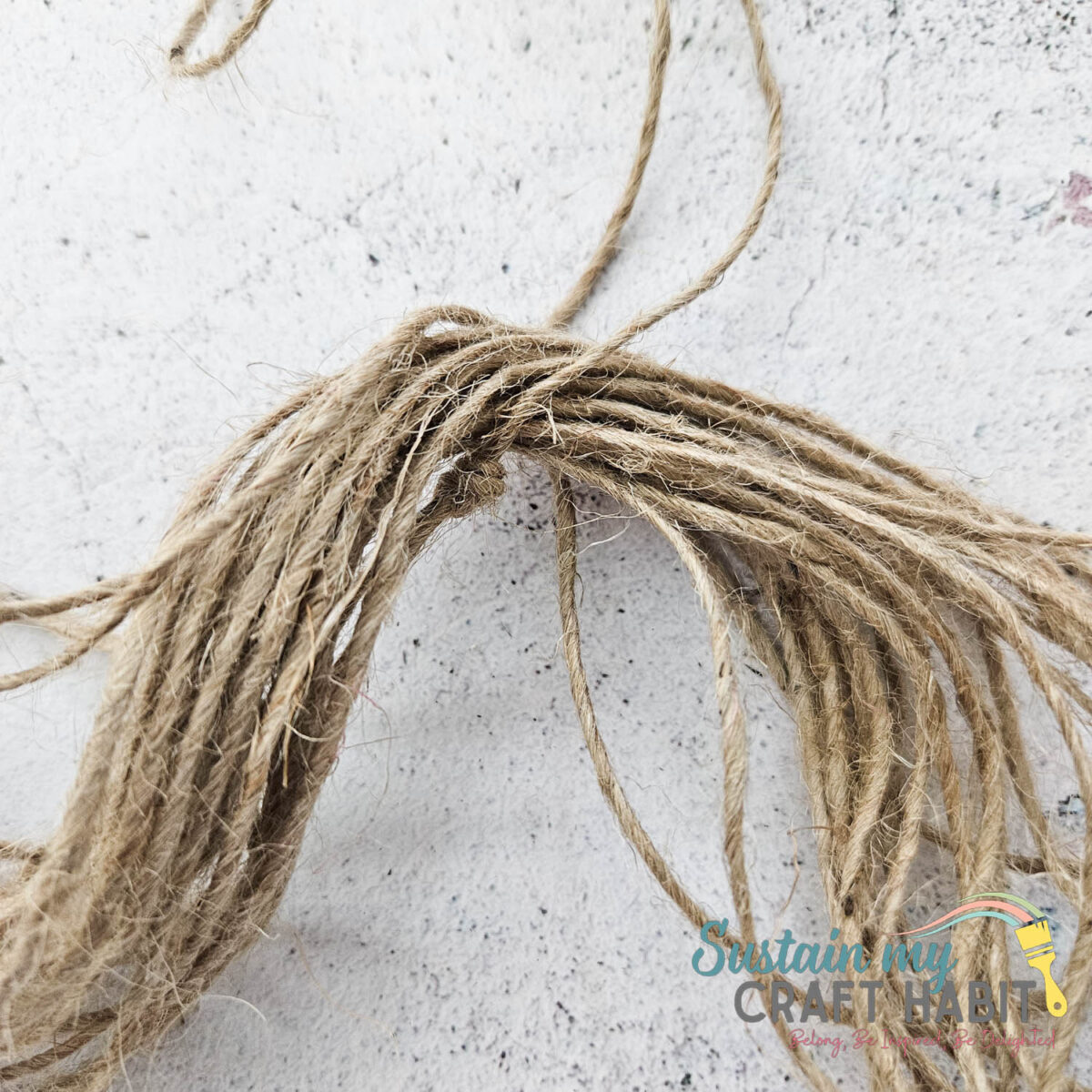 Stacking pieces of twine together. 