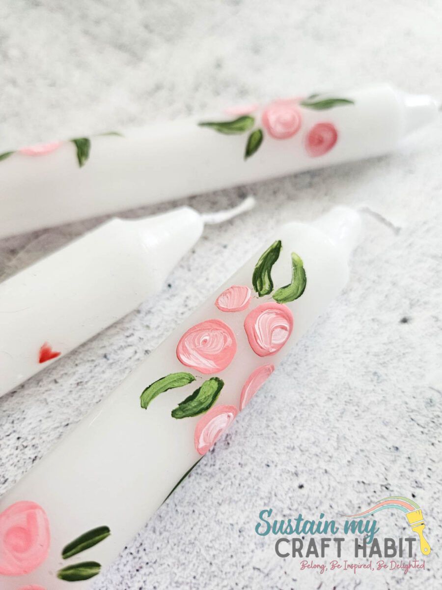 Hand painted candles with flowers.