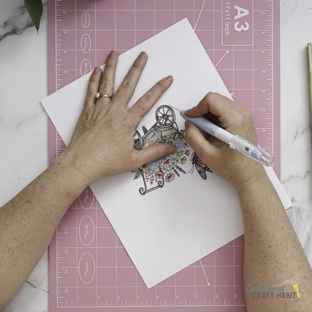 Cutting out a printed image.