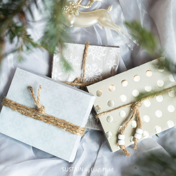collection of handmade giftcard holders wrapped with twine in assorted cardstock paper colors