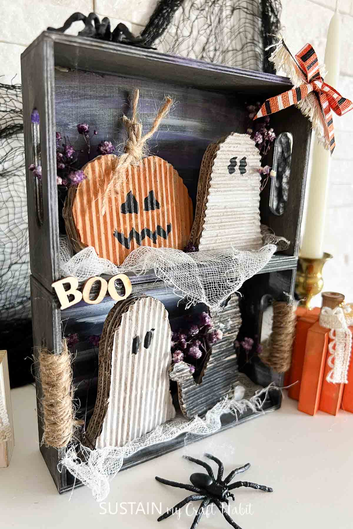 Upcycled cardboard Halloween craft made with festive characters.