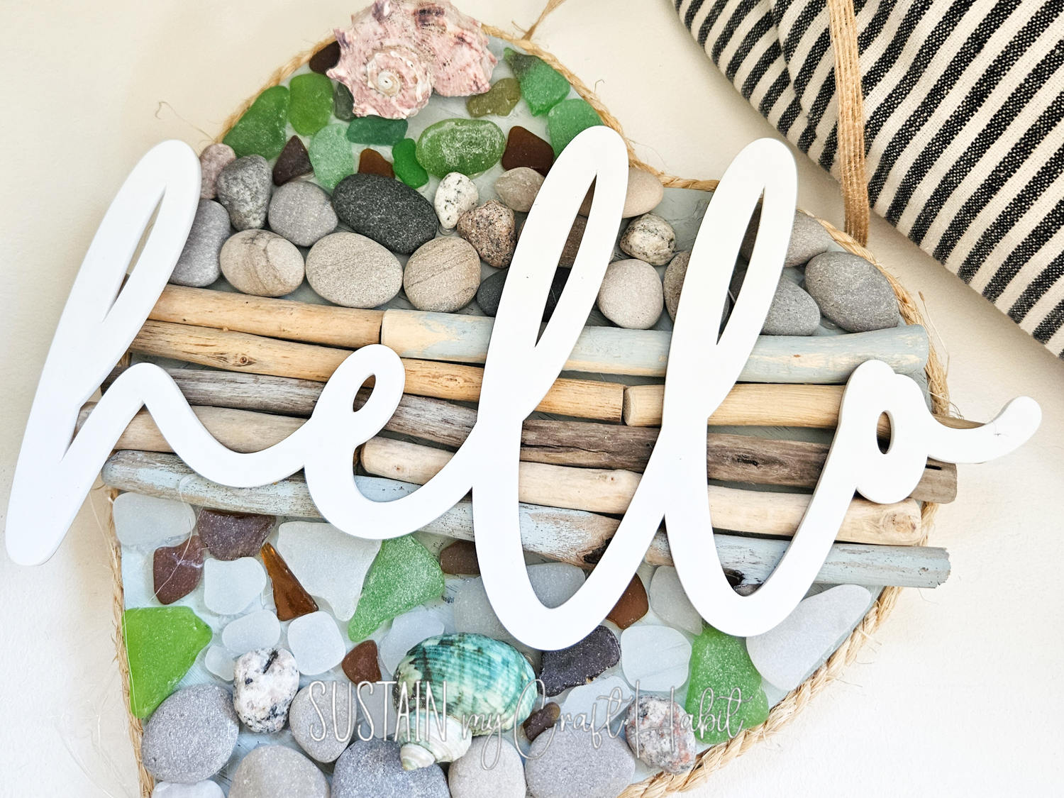 Driftwood and seaglass door sign with cutout hello.