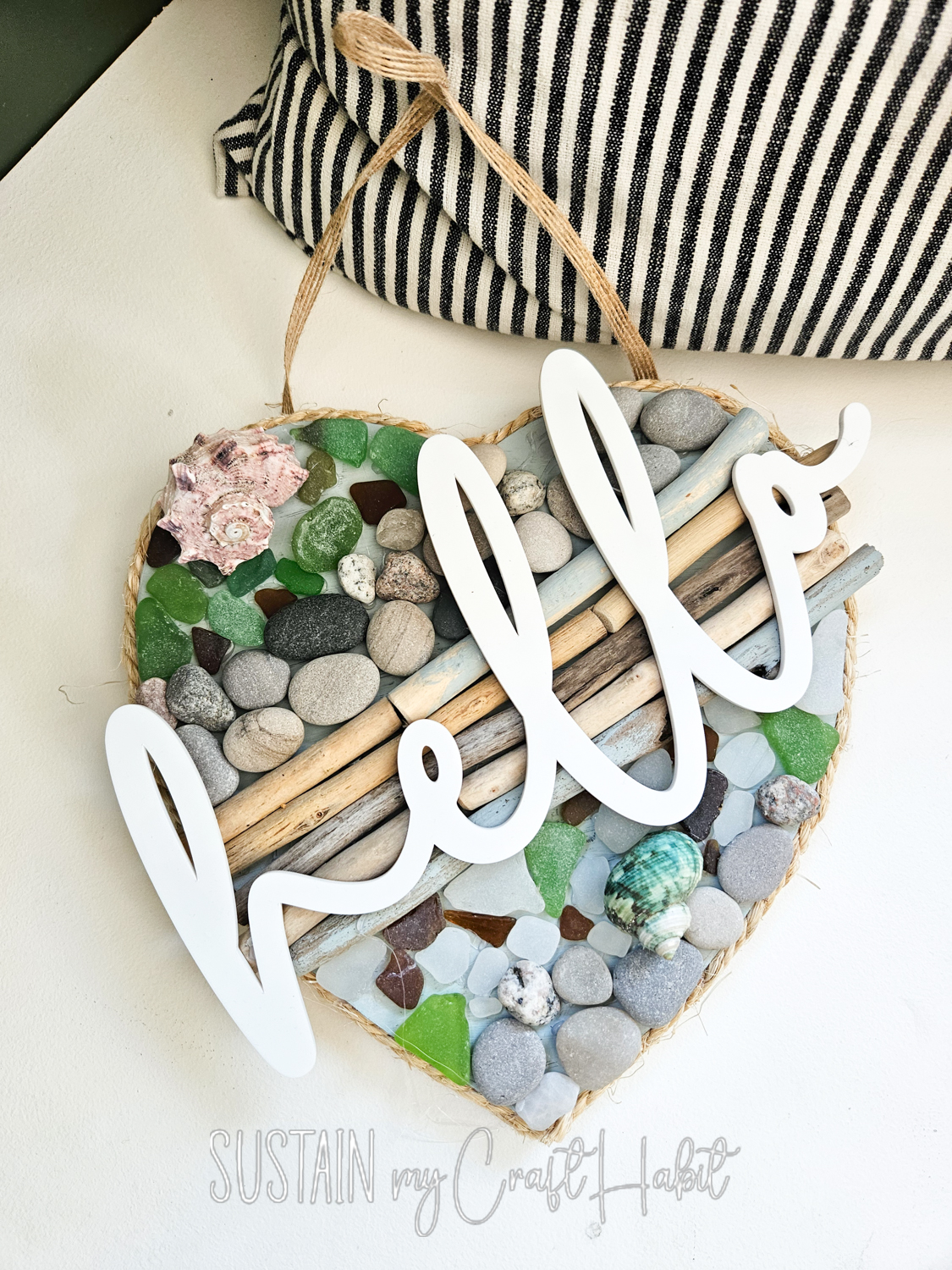Driftwood and seaglass door sign with cutout hello.