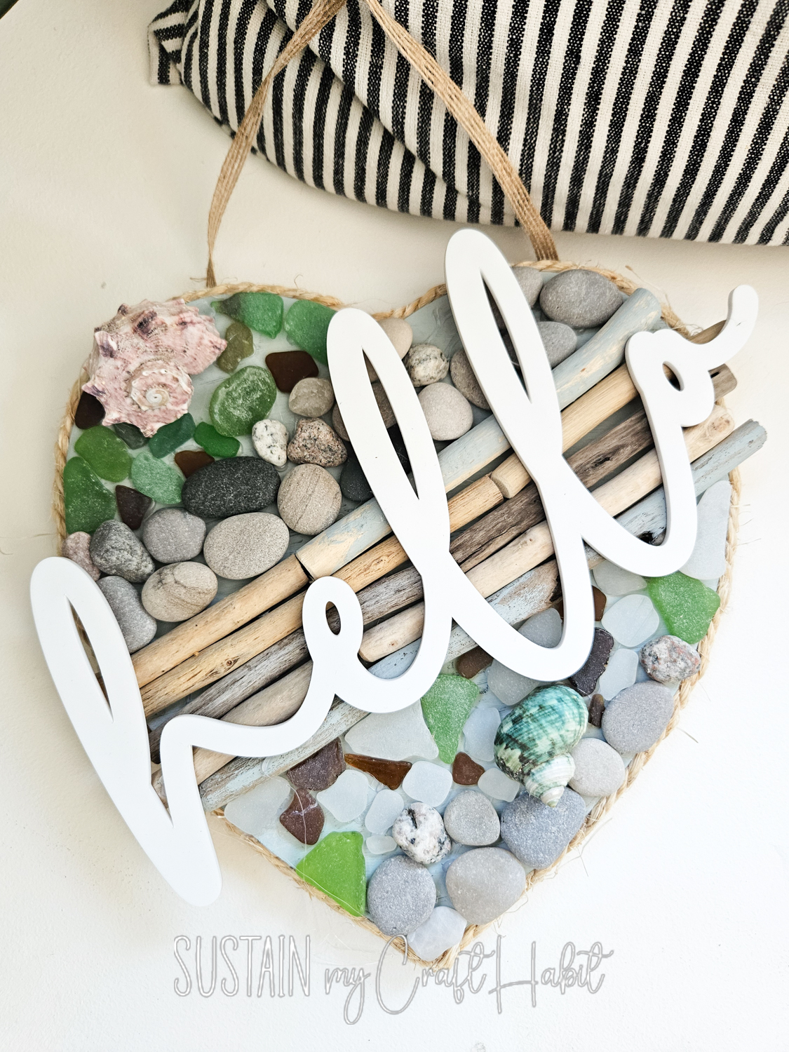 Driftwood and seaglass door sign with cutout hello.