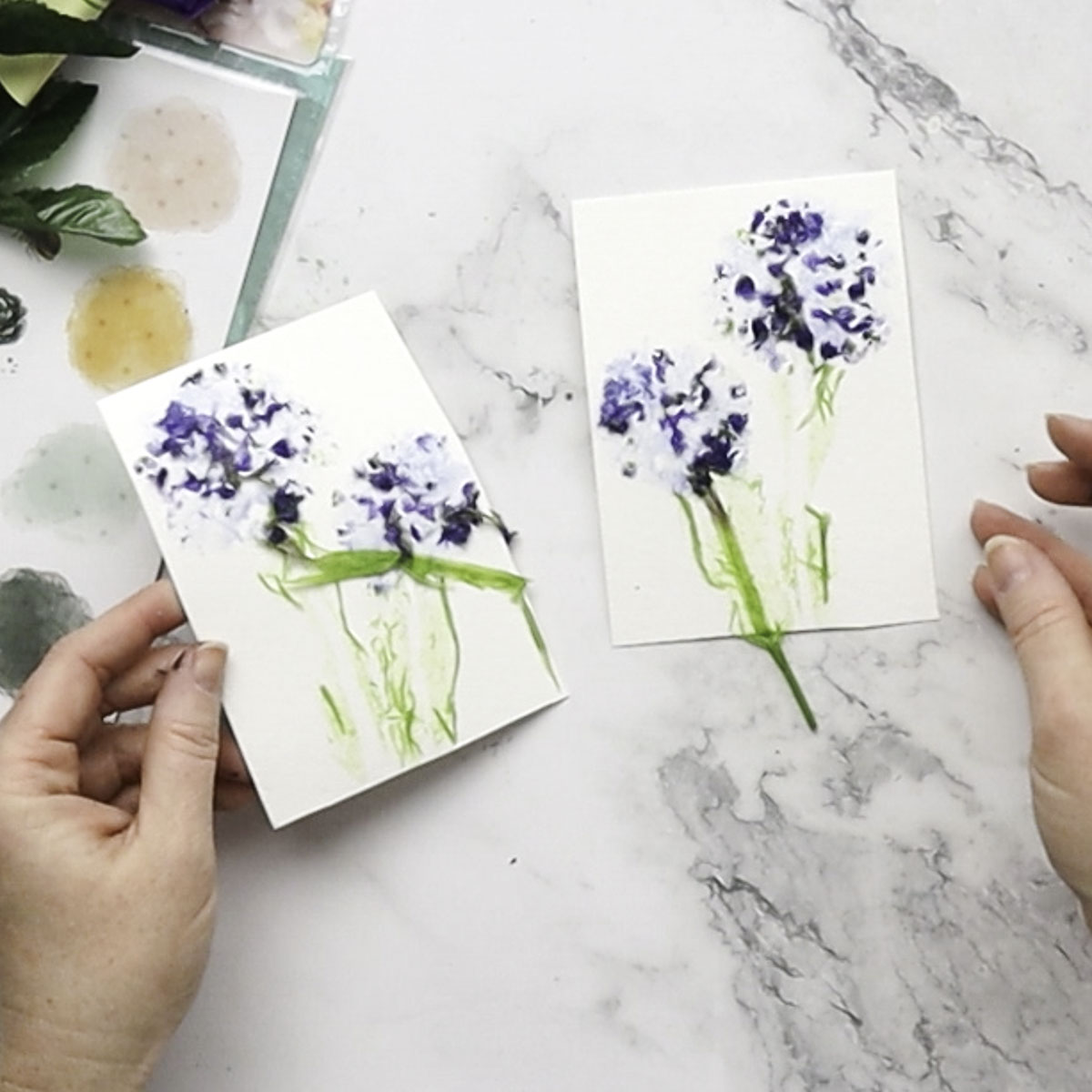 Separating paper to reveal flower print.